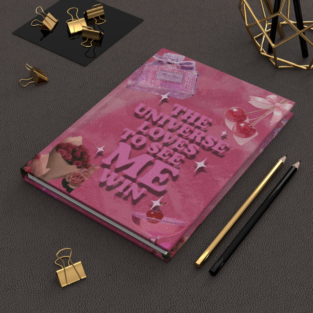 Hardcover Journal — "The Universe Loves to See Me Win" Pink Affirmation Notebook Printify