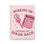 Hardcover Journal — "Working On Getting My Spark Back" Self-Love Pink Notebook for Mental Wellness & Gratitude Printify
